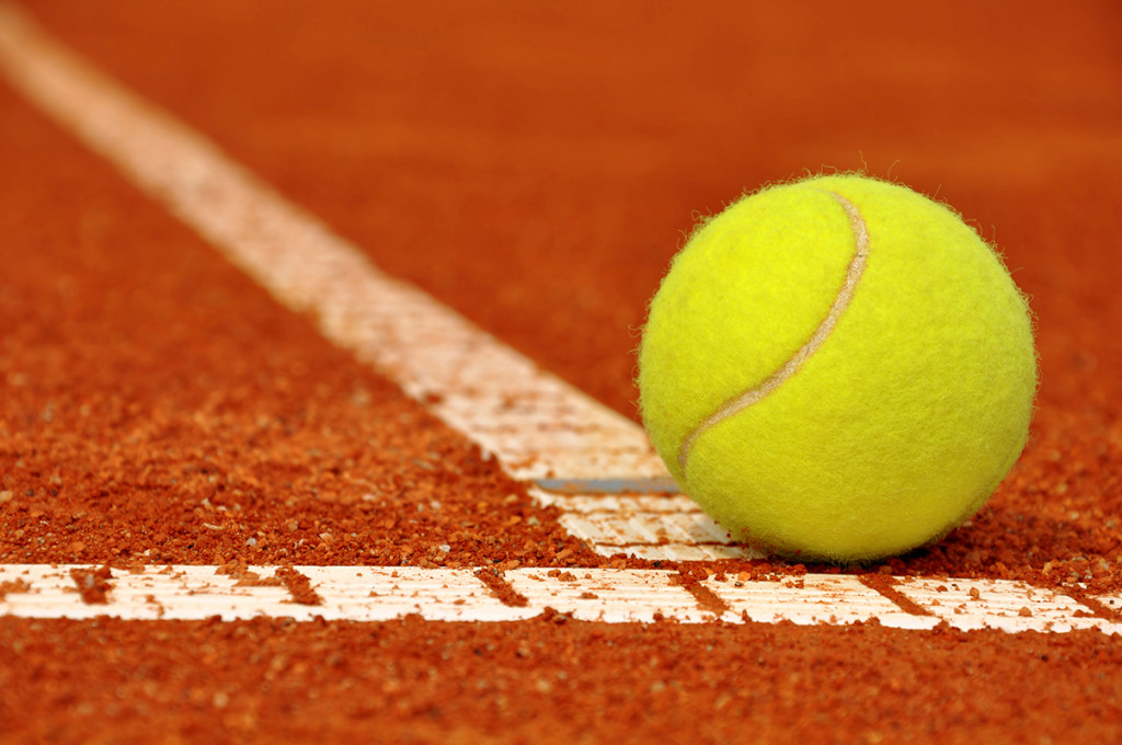 Tennis ball on a tennis clay court